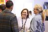 Two women smiling and talking at GDC