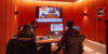Two people working together on audio editing